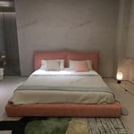 Soft Pink Upholstered Bed with Oversized Cushion Headboard & Rounded Base